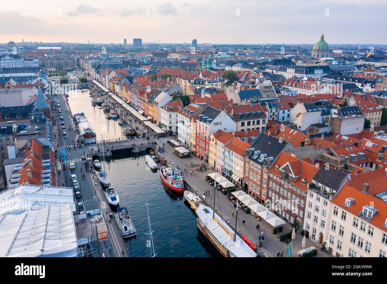Famous Nyhavn pier with colorful buildings and boats in Copenhagen, Denmark. Stock Photo