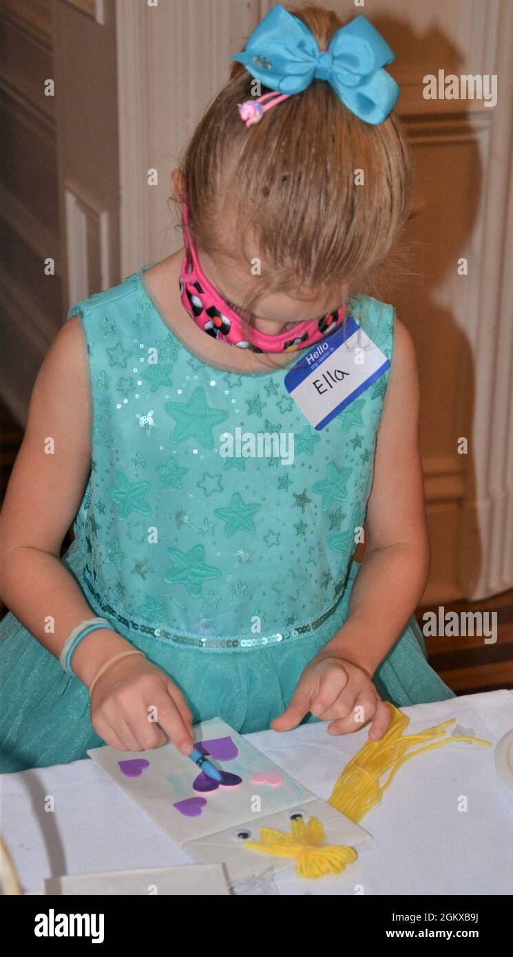 Princess Ella works on her Rapunzel hand puppet at the princess event