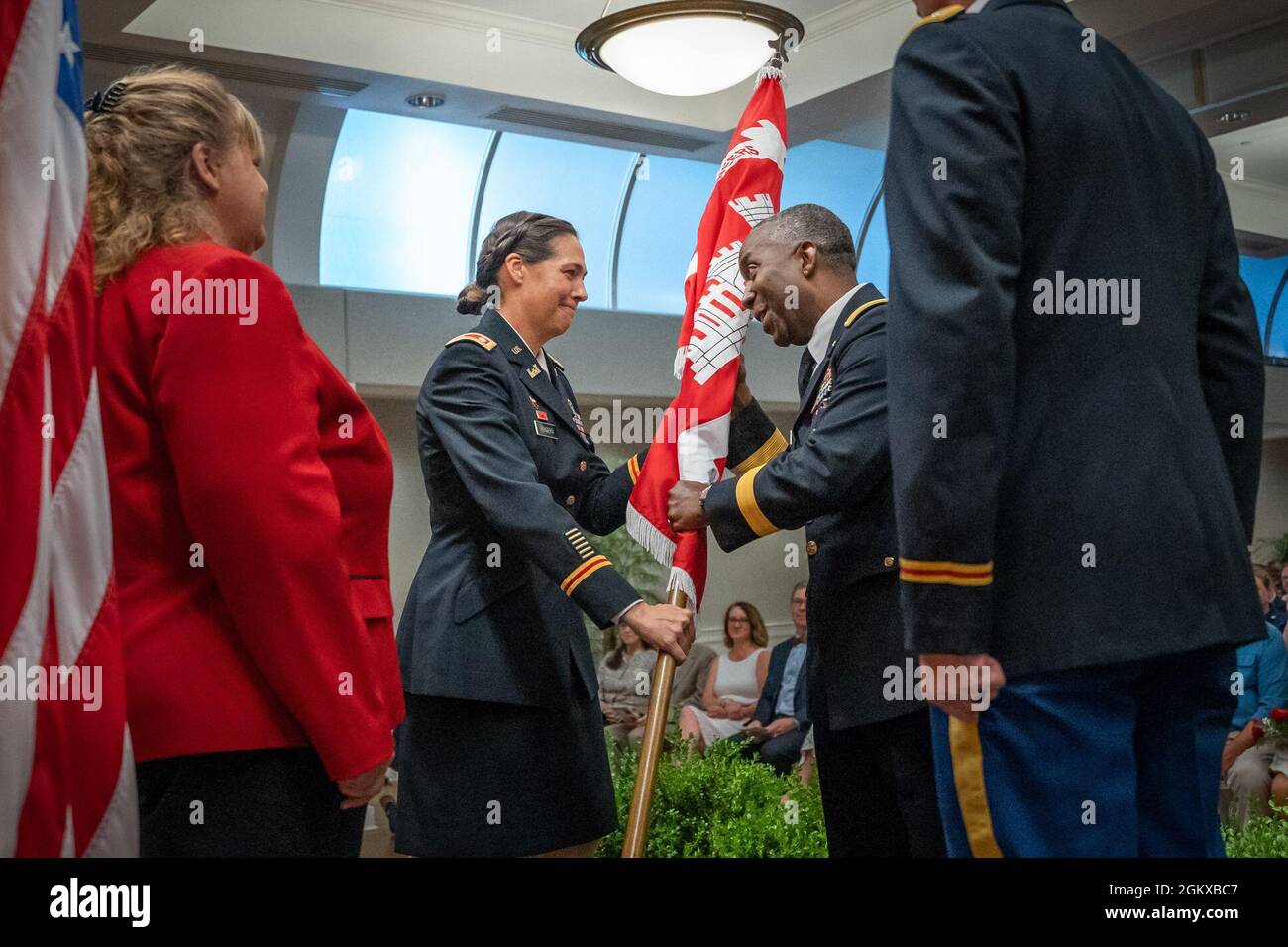 Lt. Col. Rachel Honderd hands the U.S. Army Corps Of Engineers, Charleston District guidon to Brig. Gen. Jason Kelly, commanding general for the South Atlantic Division, during a change of command.  Lt. Col. Andrew Johannes became the district’s 89th commander, taking over for Honderd. Stock Photo