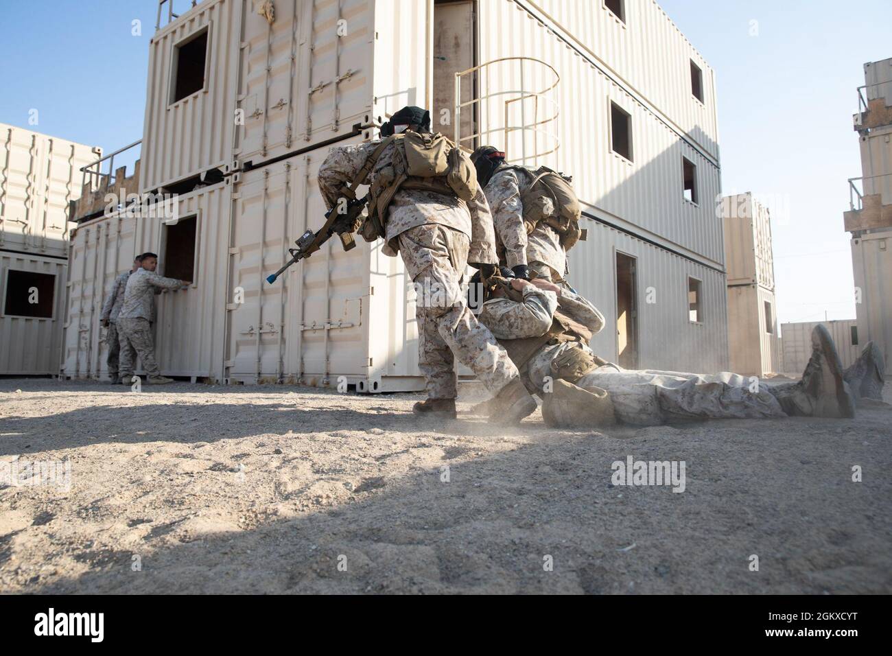 U.S. Marines with Co. L, 3rd Battalion, 4th Marine Regiment, 1st Marine Division, evacuate a simulated casualty during urban defensive training at Marine Corps Air Ground Combat Center Twentynine Palms, California, July 17, 2021. Marines with 7th Marine Regiment participated in various training exercises to compete for ‘best squad’ in preparation for Super Squad. Stock Photo