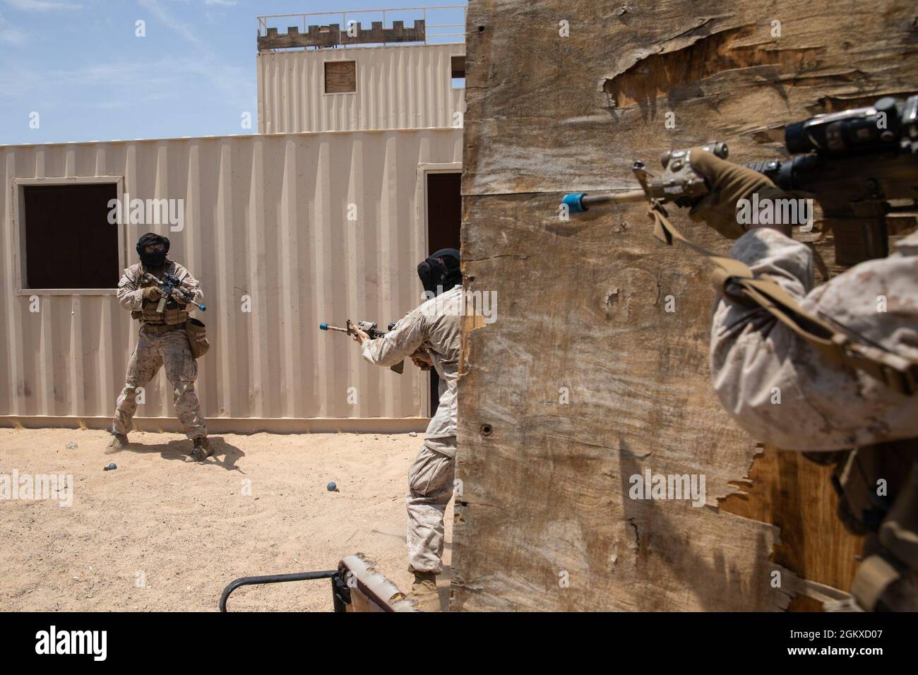 A U.S. Marines with Co. L, 3rd Battalion, 4th Marine Regiment, 1st Marine Division, aims at simulated enemies during urban defensive training at Marine Corps Air Ground Combat Center Twentynine Palms, California, July 17, 2021. Marines with 7th Marine Regiment participated in various training exercises to compete for ‘best squad’ in preparation for Super Squad. Stock Photo