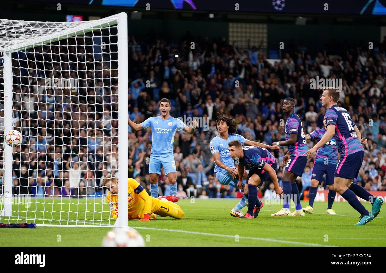 Manchester City's Nathan Ake (centre) scores their side's first goal of the game during the UEFA Champions League, Group A match at the Etihad Stadium, Manchester. Picture date: Wednesday September 15, 2021. Stock Photo