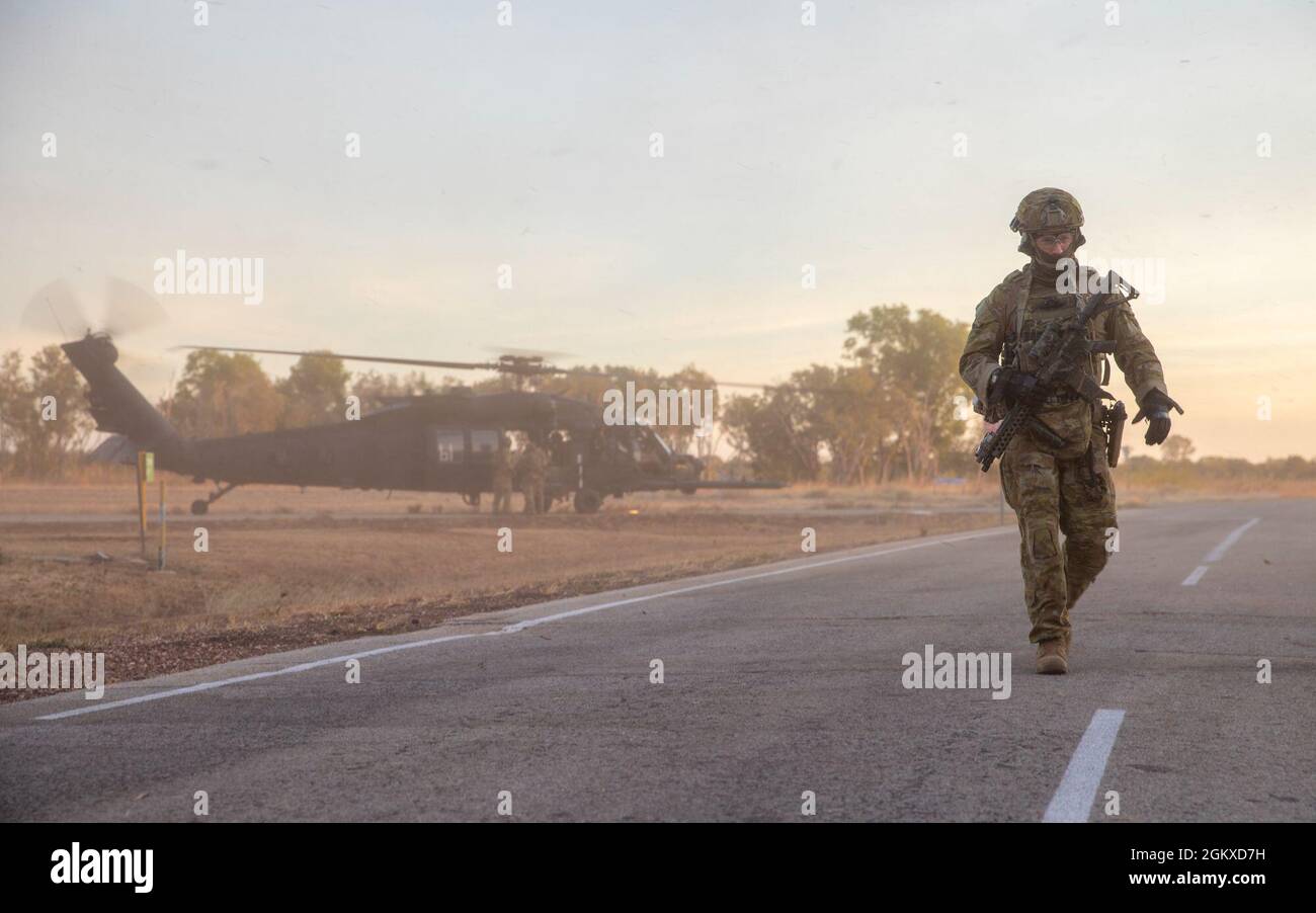 Australian Defence Force military personnel walk toward their