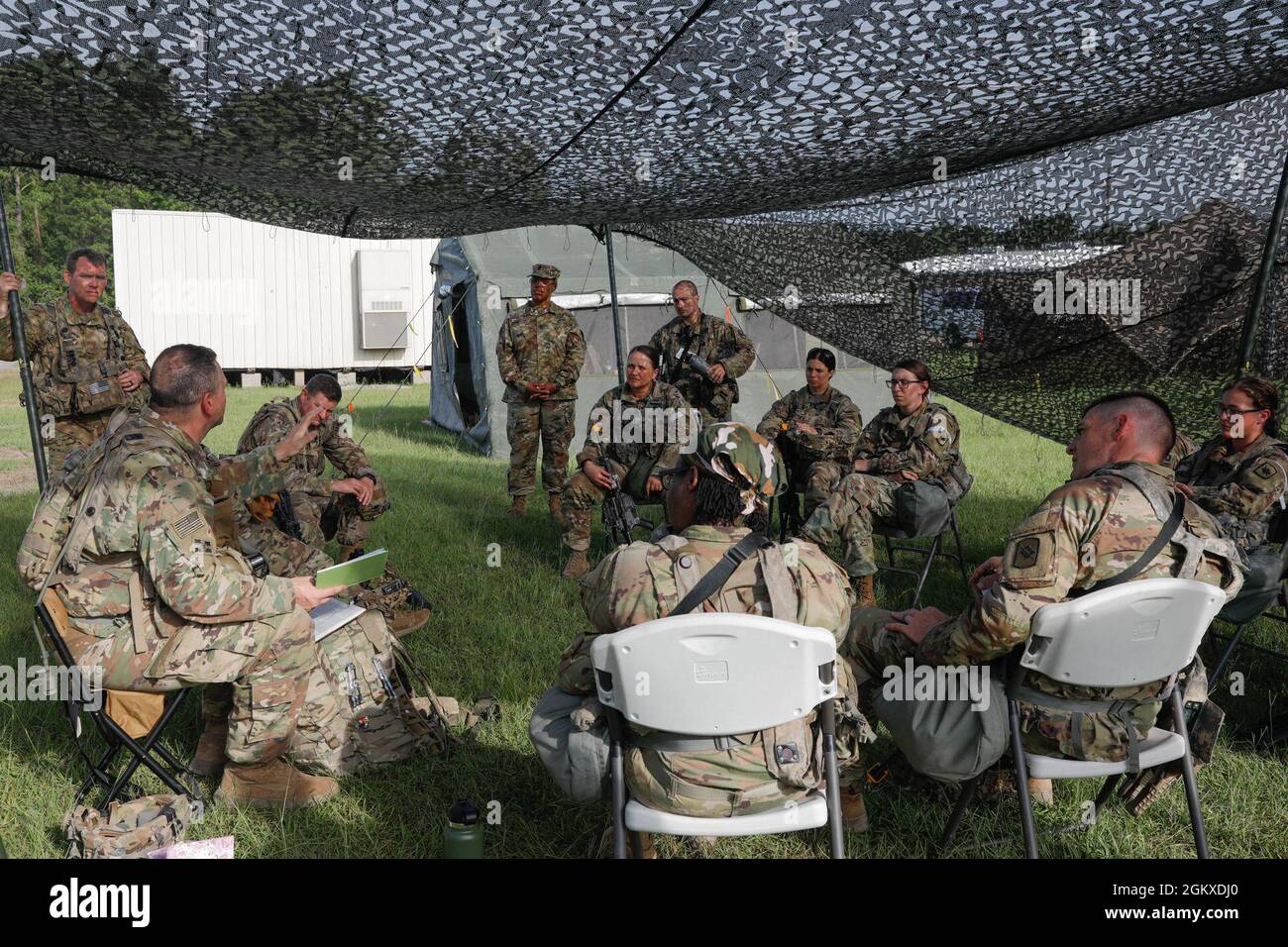 Soldiers from the 39th Infantry Brigade Combat Team attend a religious service before conducting training events at the Joint Readiness Training Center, Fort Polk, La. July 18, 2021. Stock Photo