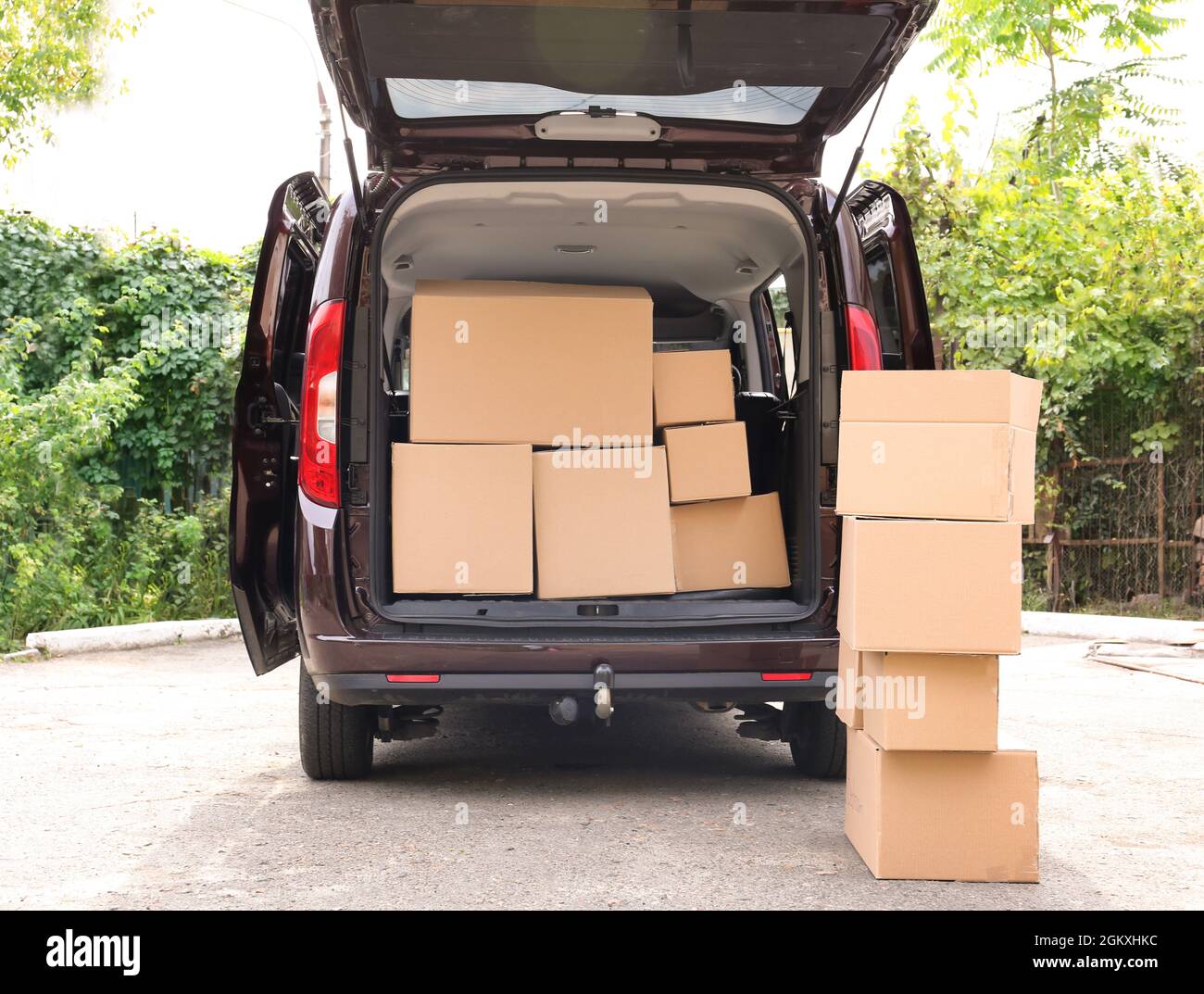 Open car trunk and moving boxes outdoors Stock Photo - Alamy
