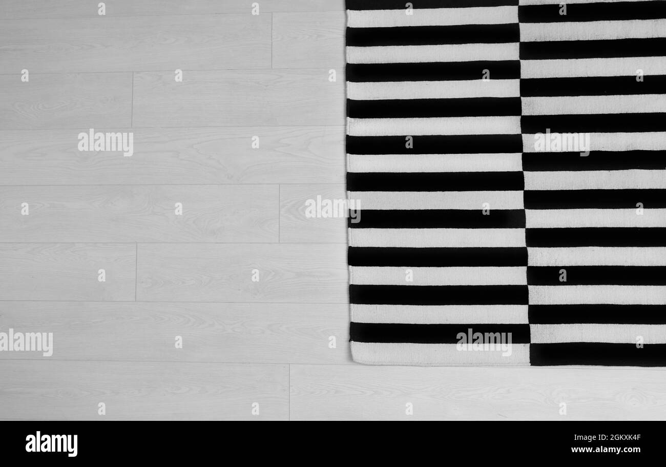 Black and white striped carpet on floor Stock Photo Alamy