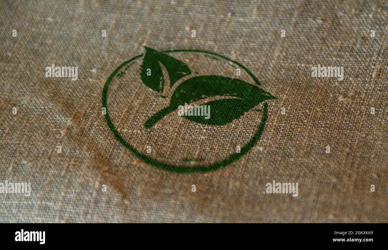 Green leaf eco friendly symbol stamp printed on linen sack. Co2 neutral