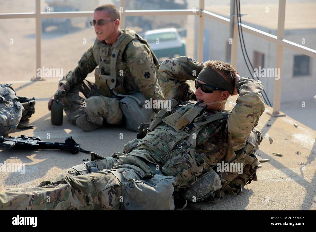 Soldiers assigned to the 45th Infantry Brigade Combat Team rest after ...