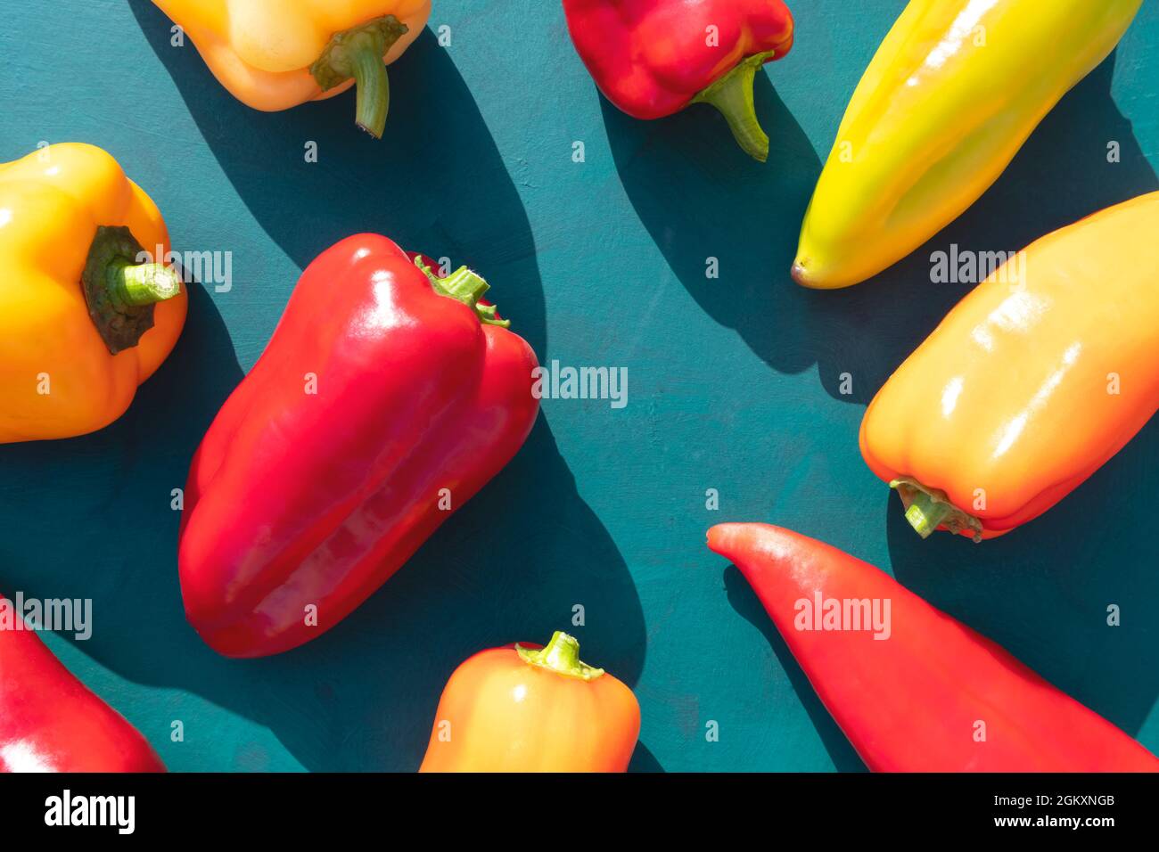 Colorful sweet peppers on a green background. A bright poster Stock ...