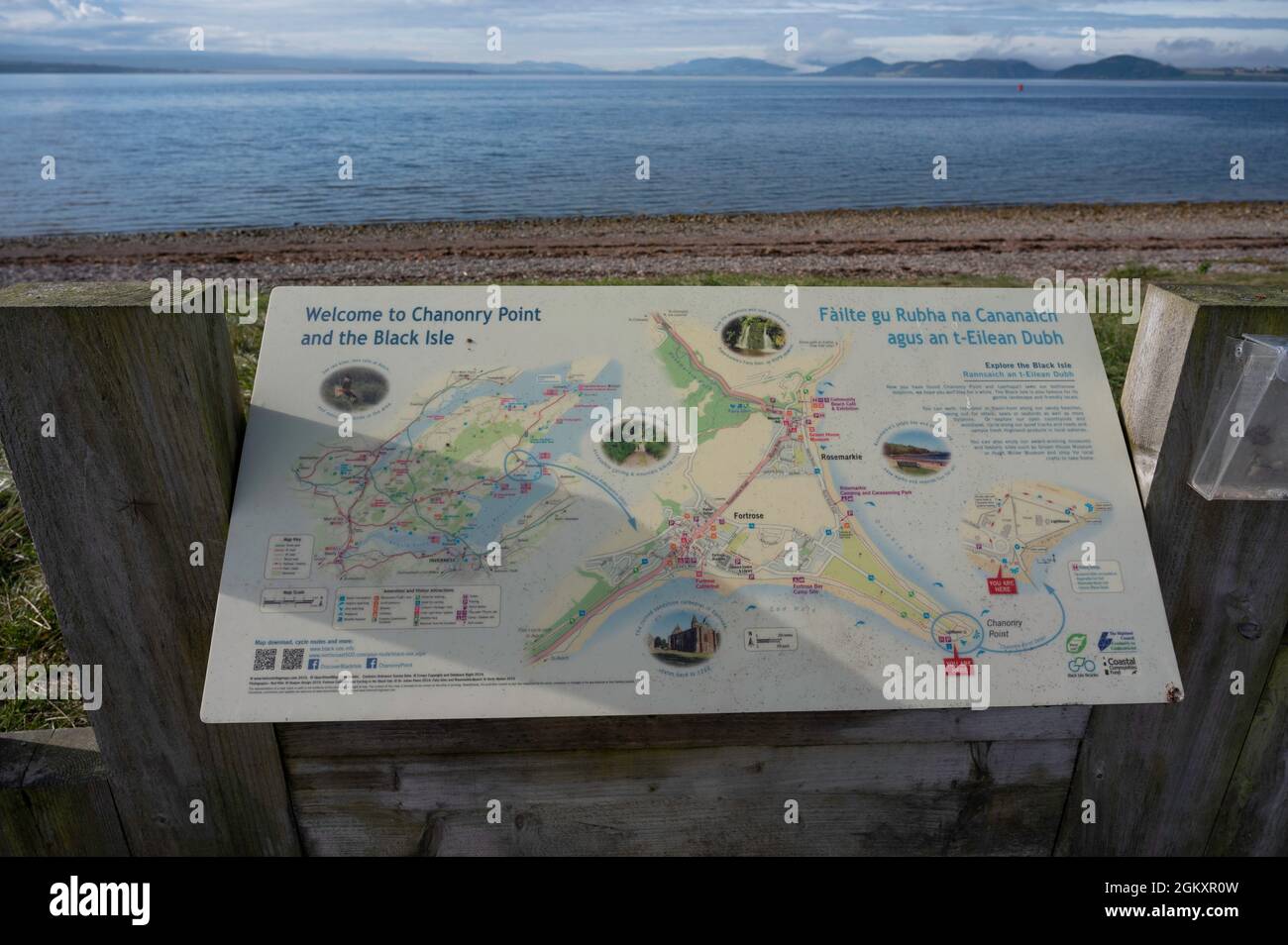 Welcome to Chanonry Point and the Black Isle sign with blurred background of beach and Moray Firth. Map with information, no people. Stock Photo