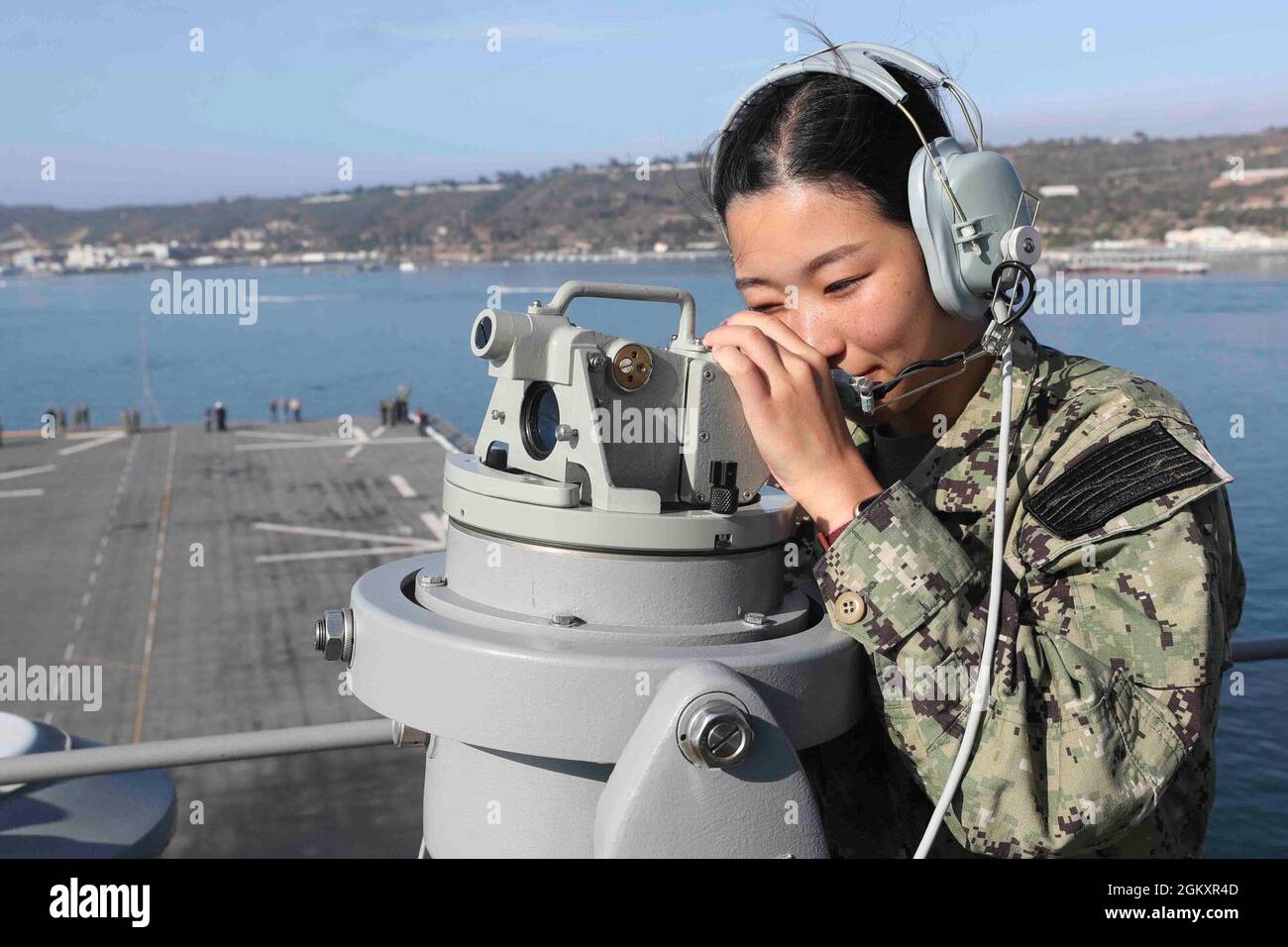 210721-N-CM110-1044 PACIFIC OCEAN (July 21, 2021) – Midshipmen Ami Kim, from Los Angeles, practices using a telescopic alidade to plot the ship’s position aboard amphibious assault ship USS Tripoli (LHA 7), July21. Tripoli is underway conducting routine operations in U.S. 3rd Fleet. Stock Photo