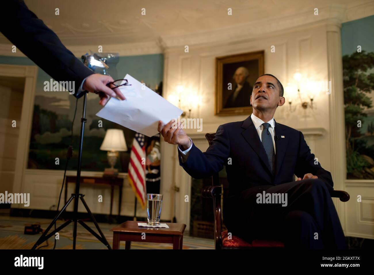 President Barack Obama prepares to record the weekly video address in the Diplomatic Reception Room of the White House, Oct. 9, 2009. (Official White House Photo by Chuck Kennedy) This official White House photograph is being made available only for publication by news organizations and/or for personal use printing by the subject(s) of the photograph. The photograph may not be manipulated in any way and may not be used in commercial or political materials, advertisements, emails, products, promotions that in any way suggests approval or endorsement of the President, the First Family, or the Wh Stock Photo