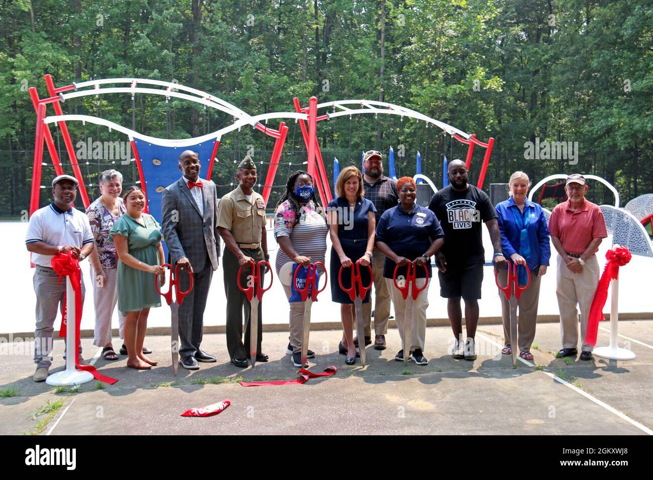 Community partners from Marine Corps Base (MCB) Quantico, Veterans and Defense Affairs, Prince William County Parks, Recreation and Tourism and Prince William County Board of Supervisors participate in the Ribbon Cutting Ceremony for the Warrior Challenge Course located outside of MCB Quantico at Locust Shade Park in Triangle, Va. MCICOM exercises command and control of Marine Corps installations via regional commanders in order to provide oversight, direction and coordination of installation services and to optimize support to the Operating Forces, tenants and activities. Stock Photo