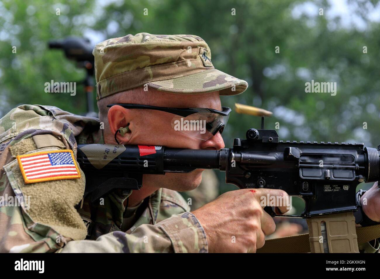 Sgt. Michael Yarrington, 108th Training Command, fires an M4 rifle at ...