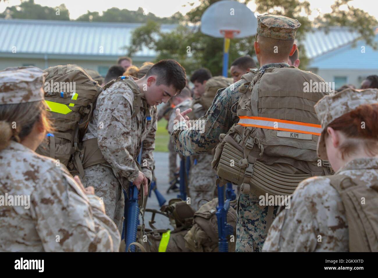 U.S. Navy students and permanent personnel of Field Medical Training Battalion-East (FMTB-E), Training Command, prepare to step off on a two-mile hike on Camp Johnson, N.C. Students participate in four different hikes during a normal training evolution to better prepare them for the physical rigors of being attached to their future U.S. Marine Corps units. Stock Photo