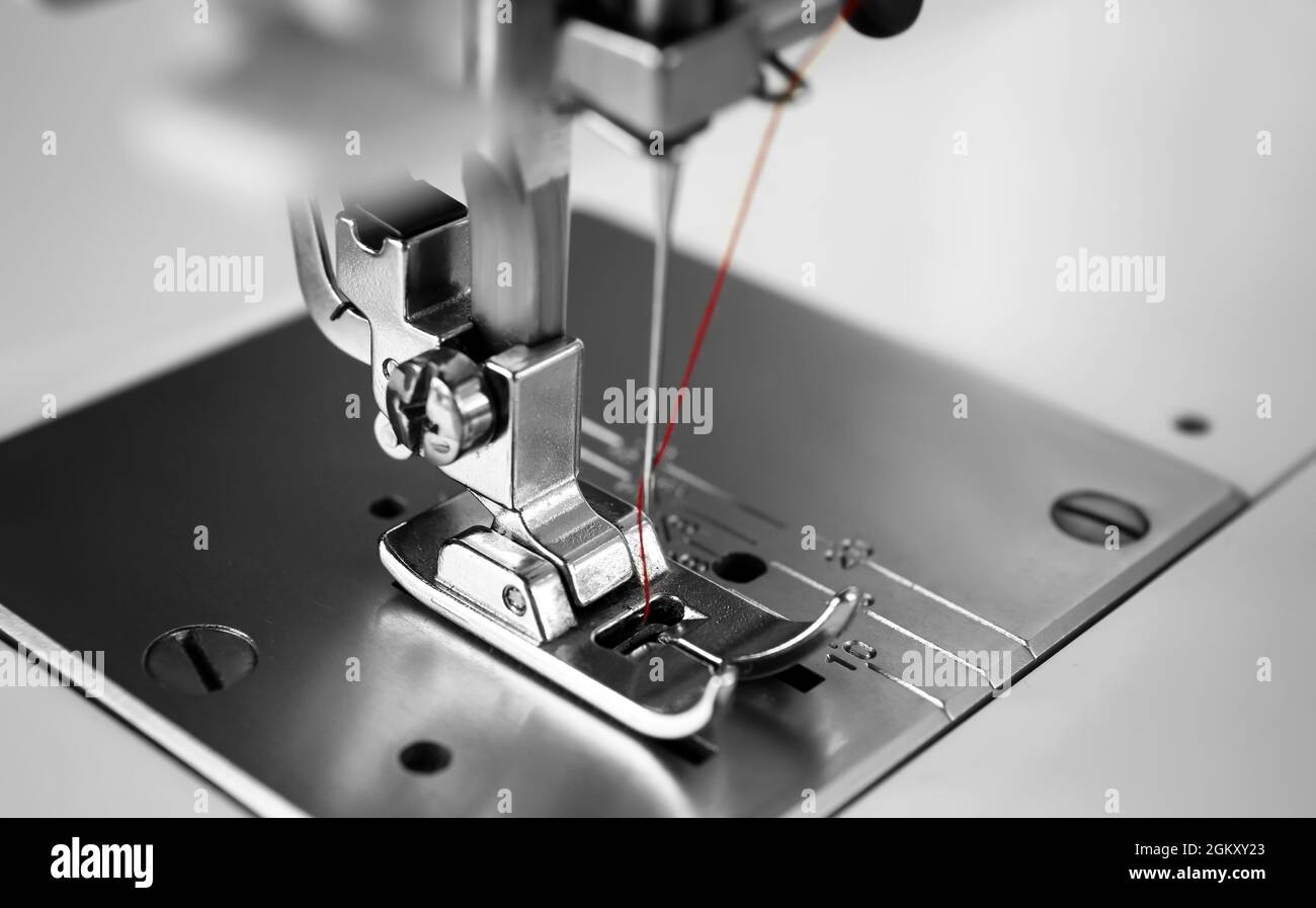Sewing machine on table, closeup Stock Photo Alamy