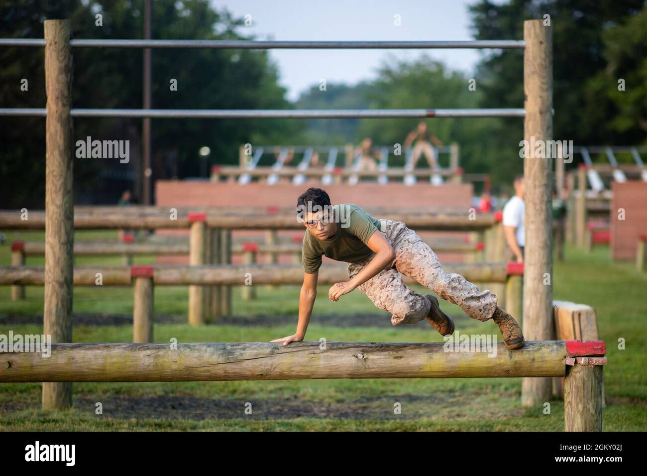 A U.S. Marine Corps officer candidate with Lima Company participates in the obstacle course at