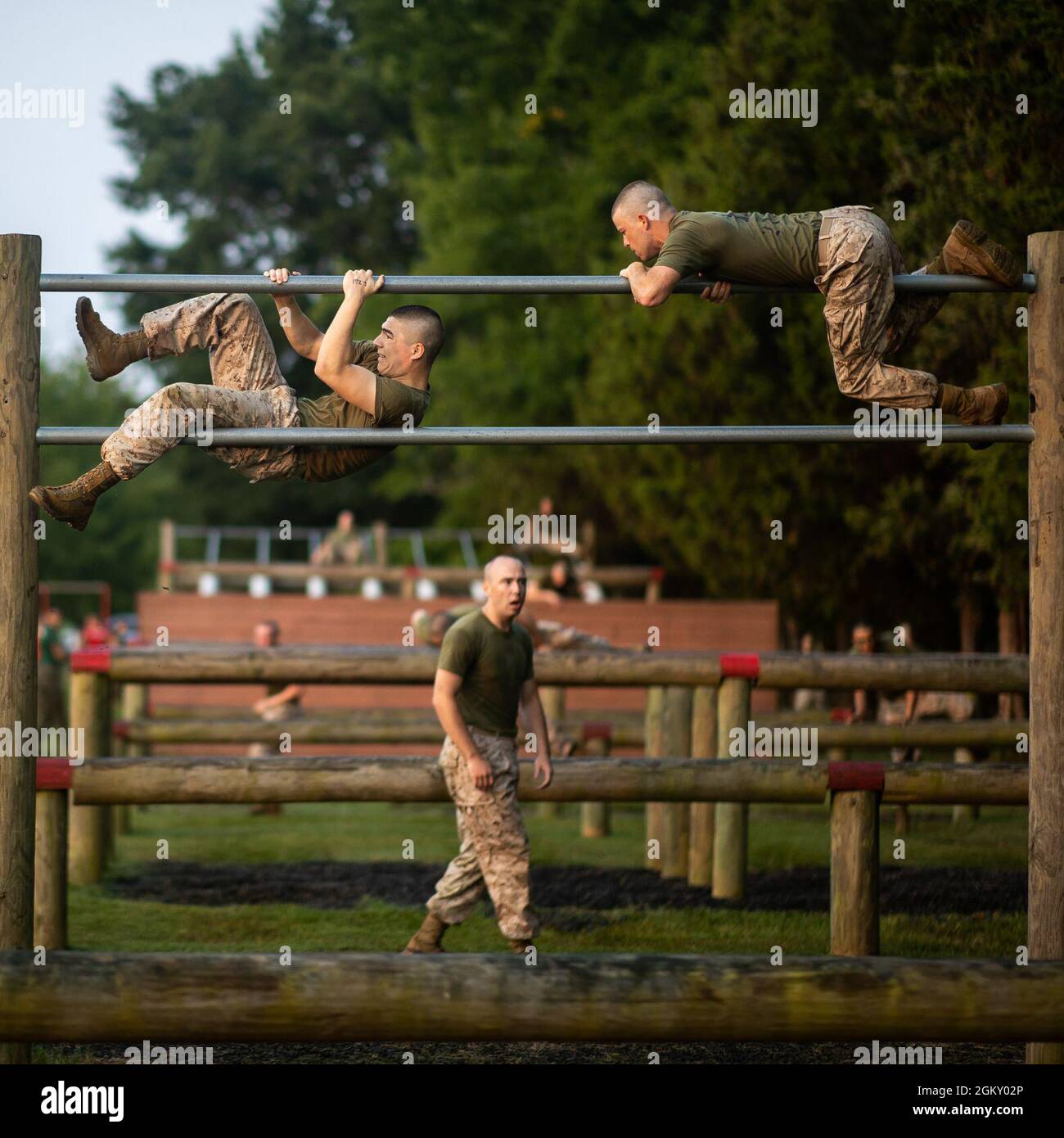 U.S. Marine Corps officer candidates with Lima Company participate in the obstacle course at