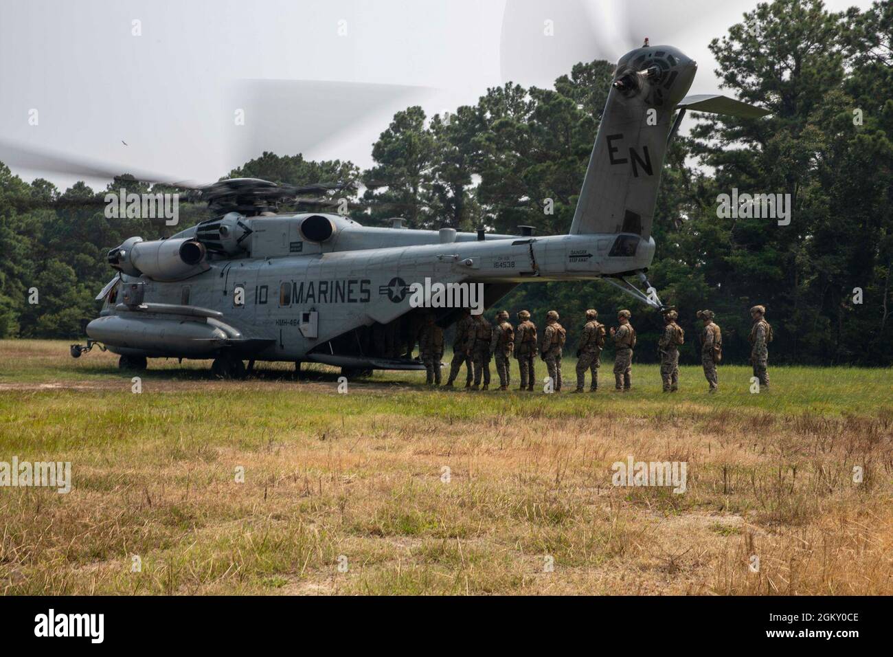 U.S. Marines with 2nd Battalion, 6th Marine Regiment, board a CH-53E ...