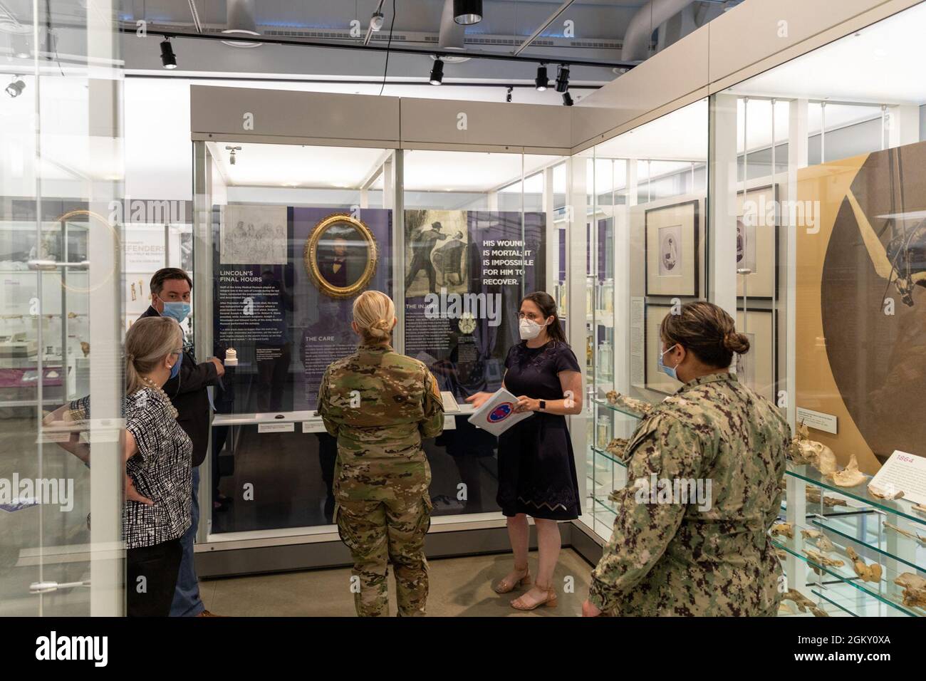 Description: Brig. Gen. Katherine Simonson 2021 Tour     Caption: Gwen Nelmes (second from right), Education Coordinator at the National Museum of Health and Medicine, provides a tour of the public galleries to Brig. Gen. Katherine Simonson, Deputy Assistant Director,  Research and Development Directorate, Defense Health Agency, and her staff on July 22, 2021, at the museum in Silver Spring, Maryland. (Disclosure: This image has been cropped to emphasize the subject.) Stock Photo