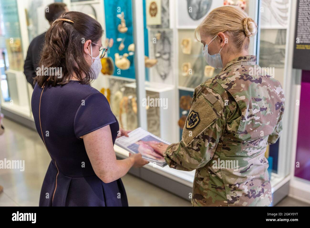 Description: Brig. Gen. Katherine Simonson 2021 Tour     Caption: Gwen Nelmes (left), Education Coordinator at the National Museum of Health and Medicine, provides a tour of the public galleries to Brig. Gen. Katherine Simonson (right), Deputy Assistant Director, Research and Development Directorate, Defense Health Agency, on July 22, 2021, at the museum in Silver Spring, Maryland. (Disclosure: This image has been cropped to emphasize the subject.) Stock Photo