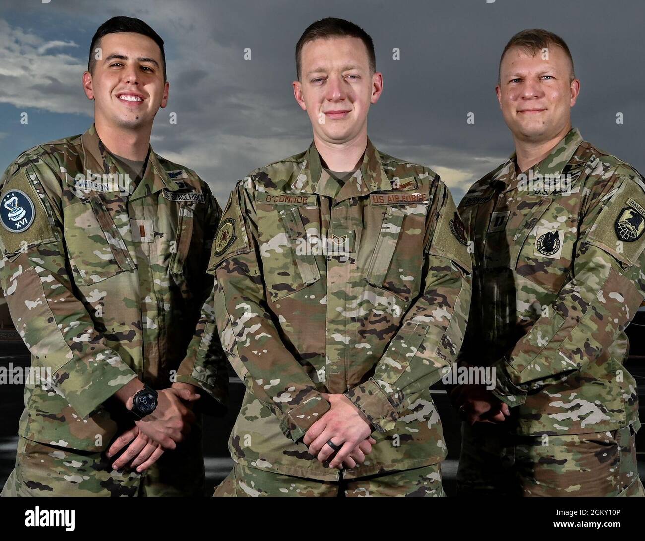 U.S. Space Force 2nd Lt. Nick Amerson, 16th Space Control Squadron crew commander, U.S. Air Force Staff Sgt. Shane O’Connor, 8th Space Warning Squadron staff instructor, and Capt. Gideon Bernthal, U.S. Army Space and Missile Defense Command G33 future operations space control planner, pose for a portrait, during Red Flag-Nellis 21-3 at Nellis Air Force Base, Nevada. Red Flag-Nellis 21-3 has hosted a new approach, integrating space components into both blue and red forces. These teams included U.S. Air Force, Army, Marines, Navy, and Space Force. Stock Photo