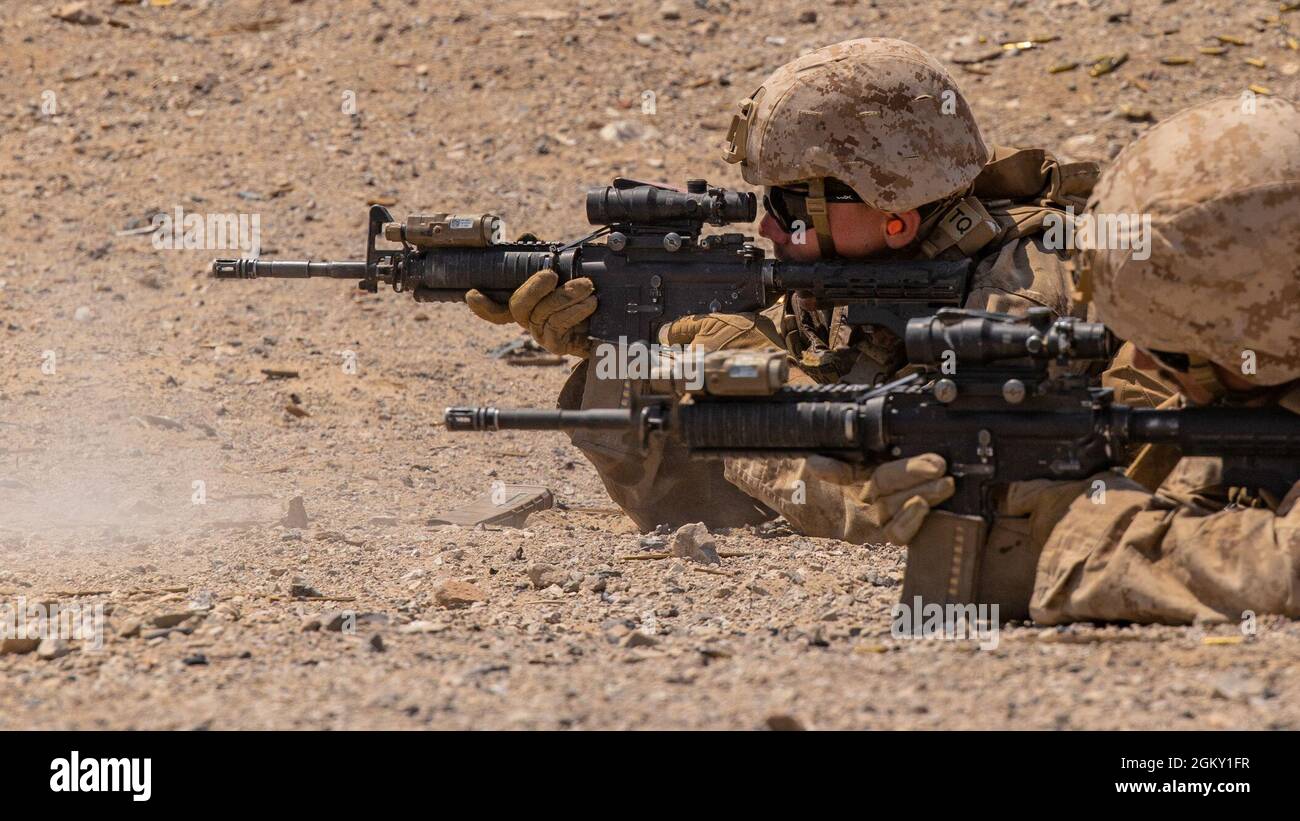 Marines with Kilo Company, 3rd Battalion, 25th Marines, 4th Marine Division, provide suppresive fire on Range 400 during Integrated Training Exercise (ITX) 4-21 at Marine Corps Air Ground Combat Center, Twentynine Palms, California on July 22. Range 400 is a company-sized live-fire assault range that requires complex coordination of fires, producing combat-ready Reserve Marines prepared to augment and reinforce the Active Component. Stock Photo
