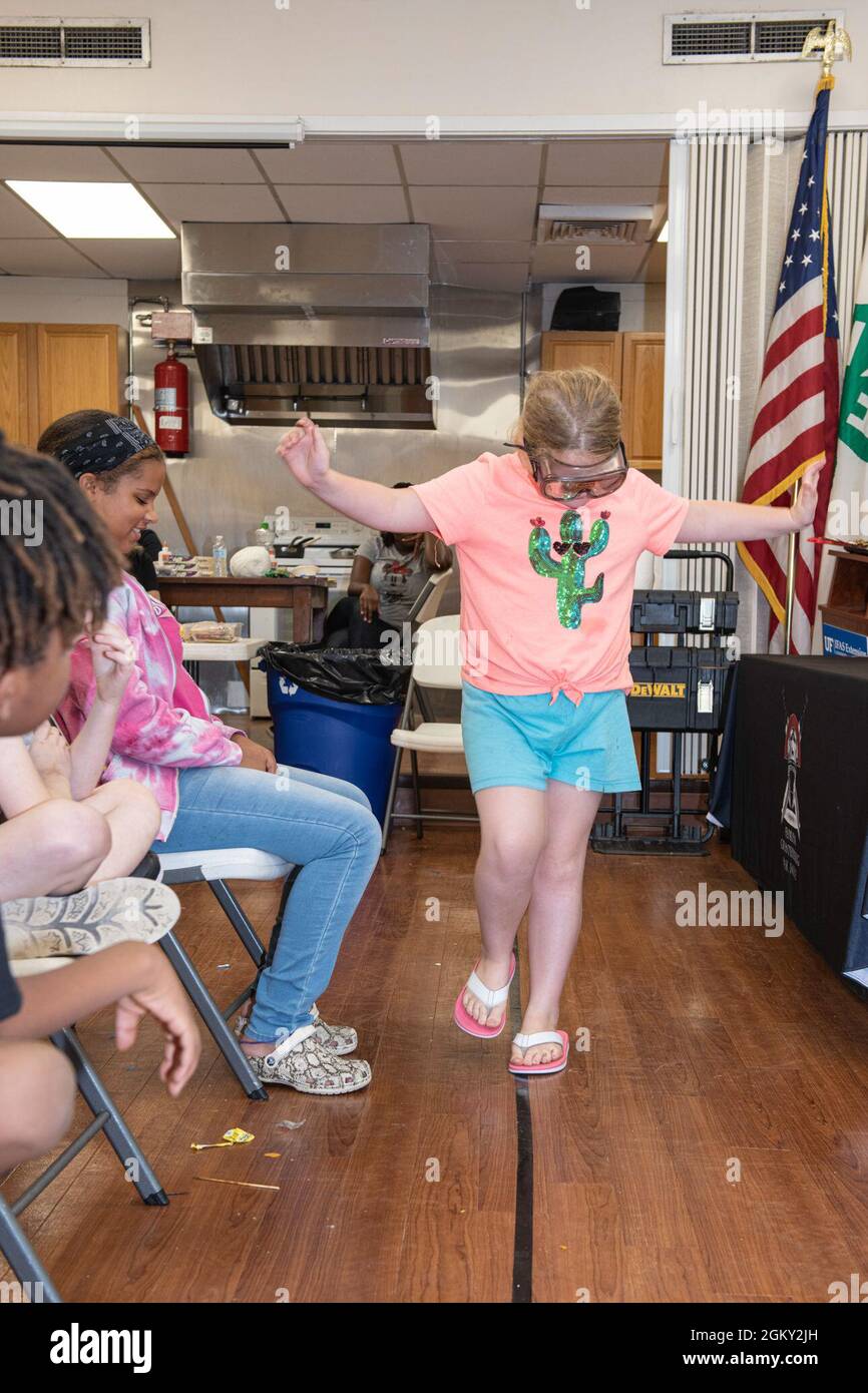 A camper attending a week-long 4H day camp attempts to walk a straight line while wearing fatal vision goggles. The goggles are designed to simulate some effects of alcohol on the wearer. The demonstration was part of a gateway drug education and prevention lecture provided by the Florida National Guard’s Drug Demand Reduction Outreach section of Counterdrug. Stock Photo
