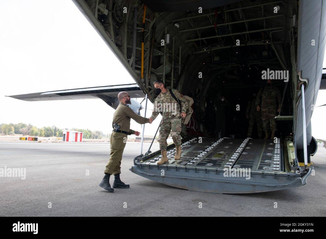 U.S. Air Force Lt. Gen. Steven Basham, U.S. Air Forces in Europe and Air Forces Africa deputy commander and Joint Task Force - Israel commander, is greeted by Israeli Defense Forces Maj. Moses Bata, air base deputy chief, upon arrival in Israel to participate in Juniper Falcon 2021-2, July 23, 2021. Juniper Falcon serves as an opportunity for U.S. military personnel and the IDF to train together and learn from one another. JF21-2 represents another step in the deliberate and strategic relationship between the U.S. and Israel and contributes to the overall regional stability. Stock Photo