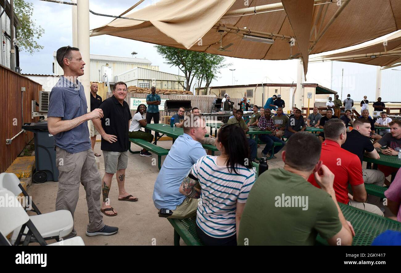 CAMP LEMONNIER, Djibouti (July 24, 2021) U.S. Army Maj. Gen. William L. Zana, Commanding General, Combined Joint Task Force-Horn of Africa, speaks with civilians, French and U.S. service members during a Eid al-Adha celebration meal at Camp Lemonier, July 24, 2021. Service members hosted the celebration to commemorate the Eid al-Adha holiday observed by Muslims worldwide. Stock Photo