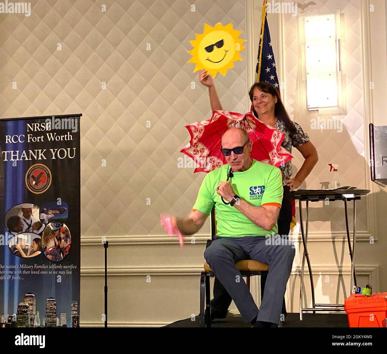 210724-N-FR750-5577 AUSTIN, Texas (July 24, 2021) – Presenter and retired Navy Capt. Christopher Staeheli with assistant Karen Alexandrou use props and humor to illustrate Operational Stress cycles during a session of the Returning Warrior Workshop (RWW) in Austin, TX, July 23-25. Returning Warrior Workshops are a component of the Yellow Ribbon Reintegration Program designed to honor service members and their families while helping the transition of Active and Reserve Component Sailors returning from deployments and individual augments. Stock Photo