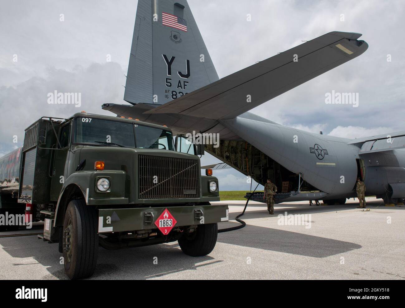 U.S. Air Force Airmen load fuel from an R-11 refueling truck onto a C ...