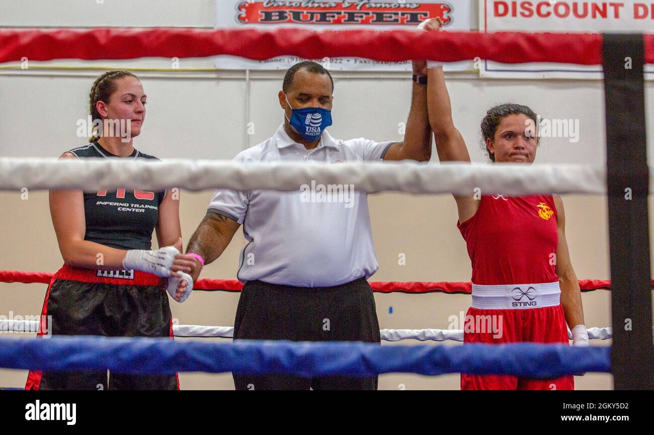 U.S. Marine Corps 1st Lt. Stephanie Simon, II Marine Expeditionary Force, Martial Arts Center of Excellence, wins a bout during the Christy Martin’s Title Boxing Invitational,  Fayetteville, N.C., July 25, 2021. The Christy Martin’s Title Boxing Invitational, named after the 2019 International Hall of Famer, attracted elite fighters from across the eastern Carolinas. The II MEF MACE achieved five weight-class championships and won the overall Team Belt. Stock Photo