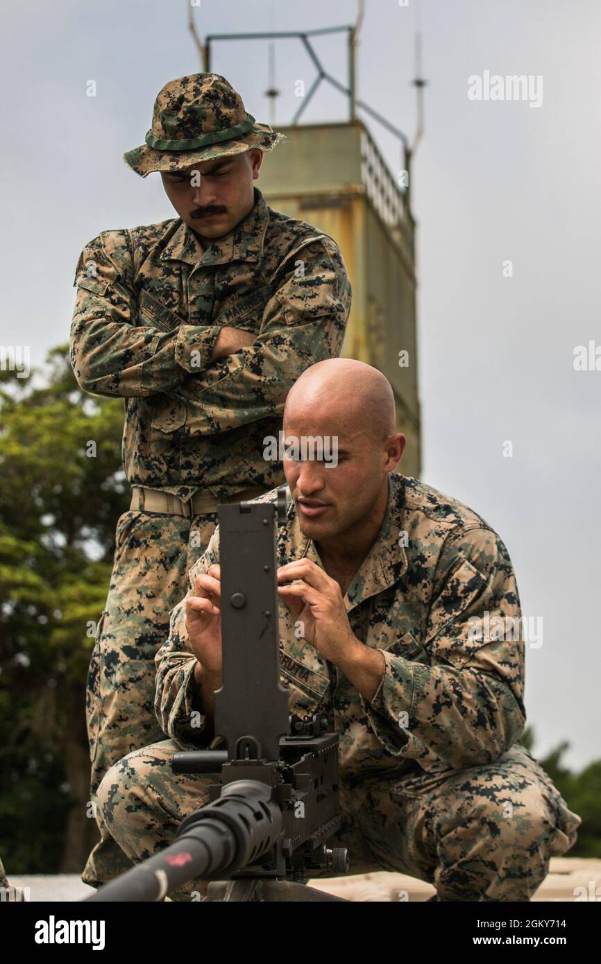 U.S. Marine Corps Cpl. Idan Urrutiagarces, right, a section leader, and