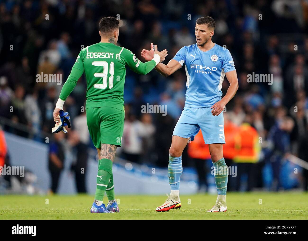 Manchester City goalkeeper Ederson (left) and Ruben Dias shake hands after the UEFA Champions League, Group A match at the Etihad Stadium, Manchester. Picture date: Wednesday September 15, 2021. Stock Photo