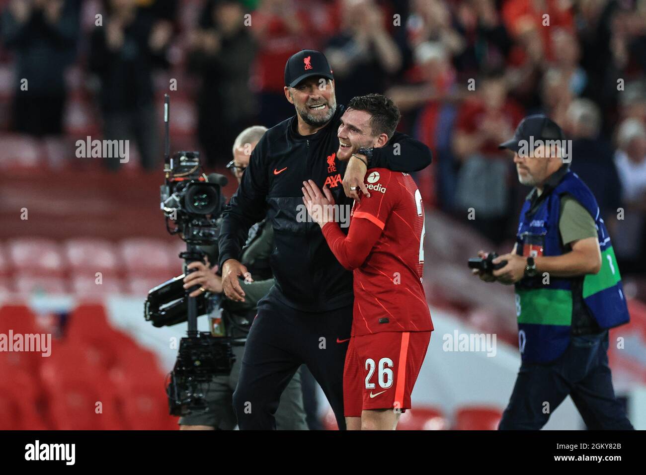 Jürgen Klopp manager of Liverpool embraces Andrew Robertson #26 of Liverpool after Liverpool beat AC Milan 3-2 Stock Photo
