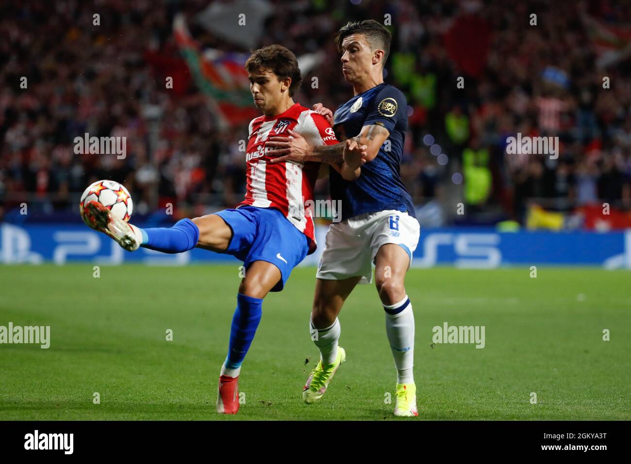 Madrid, Spain. 15th Sep 2021. Joao Felix of Atletico de Madrid in action with Mateus Uribe of FC Porto during the UEFA Champions League match between Atletico de Madrid and FC Porto at Wanda Metropolitano in Madrid, Spain. Credit: DAX Images/Alamy Live News Stock Photo