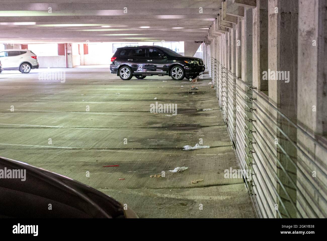 WASHINGTON, DC (July 27, 2021) – Litter covers the pavement of a parking garage onboard Washington Navy Yard prior to a base clean-up event. Stock Photo