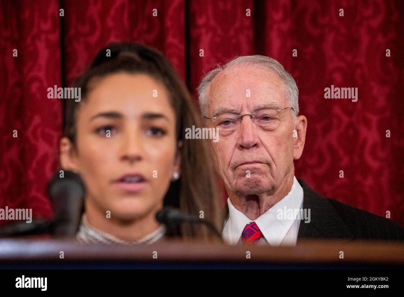 United States Senator Chuck Grassley (Republican of Iowa) listens as former U.S. Olympic gymnast Aly Raisman offers remarks during a press conference to talk about the abuse that she and other women gymnasts experienced from Larry Nassar, the now-incarcerated U.S. women's national gymnastics team doctor, and the FBIâs handling of their cases, in the Russell Senate Office Building in Washington, DC, Wednesday, September 15, 2021. Credit: Rod Lamkey/CNP Stock Photo