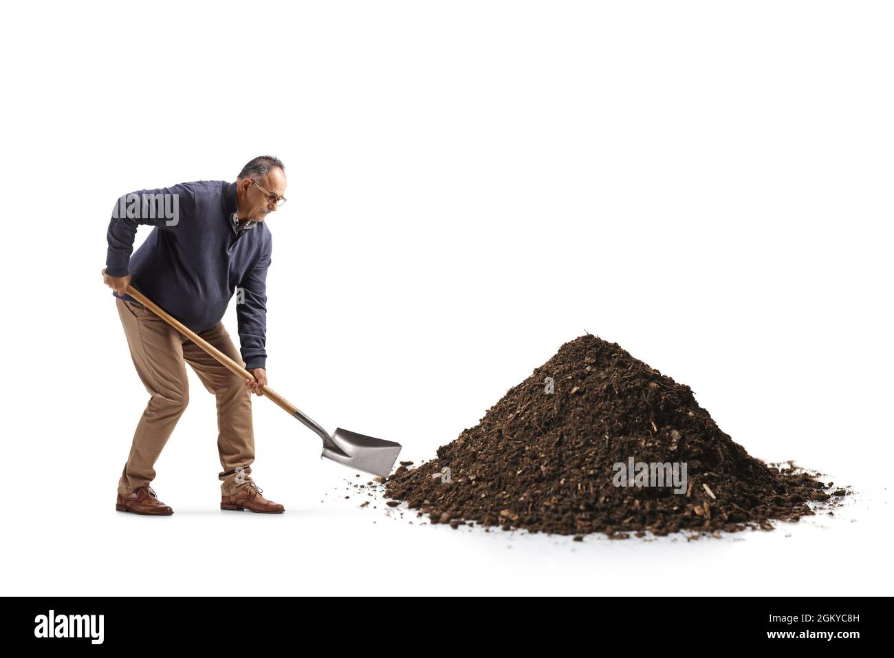 Pile of soil with a shovel Cut Out Stock Images & Pictures - Alamy