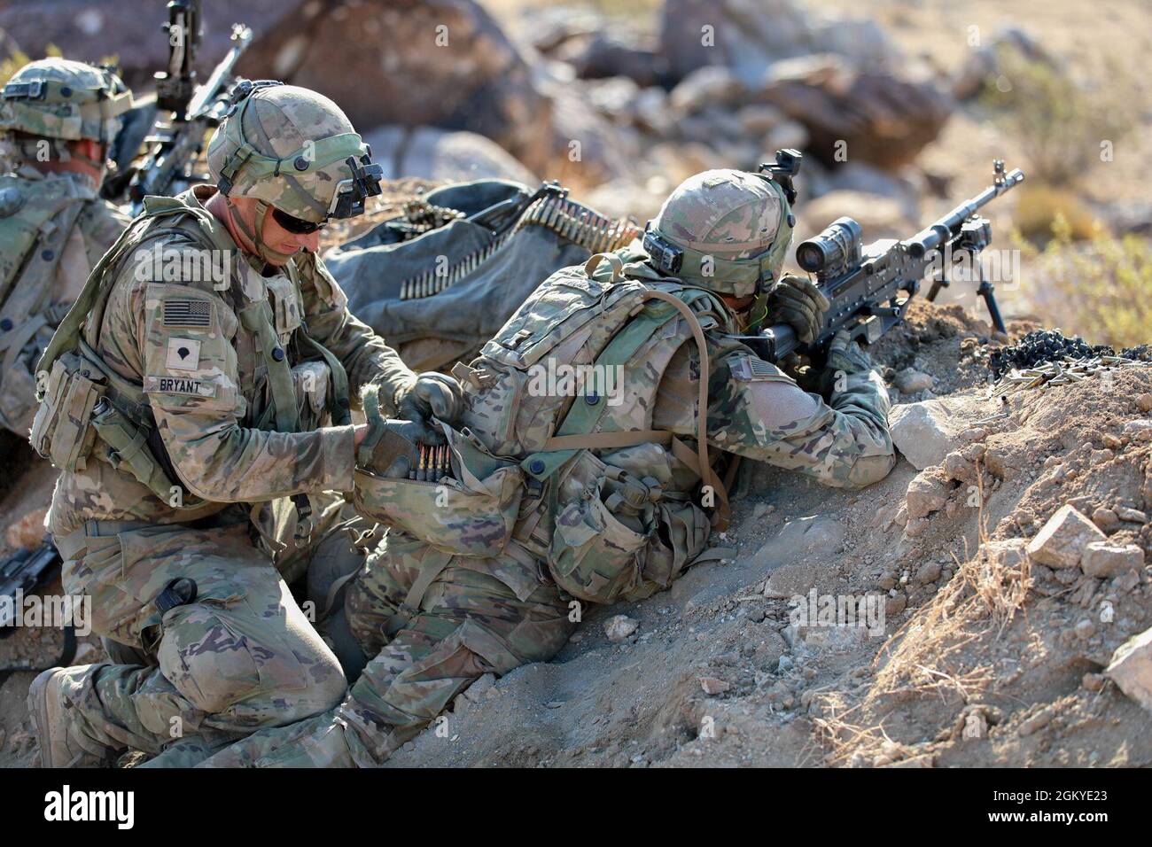 Soldier with the 45th Infantry Brigade Combat Team reloads a gunner’s ...