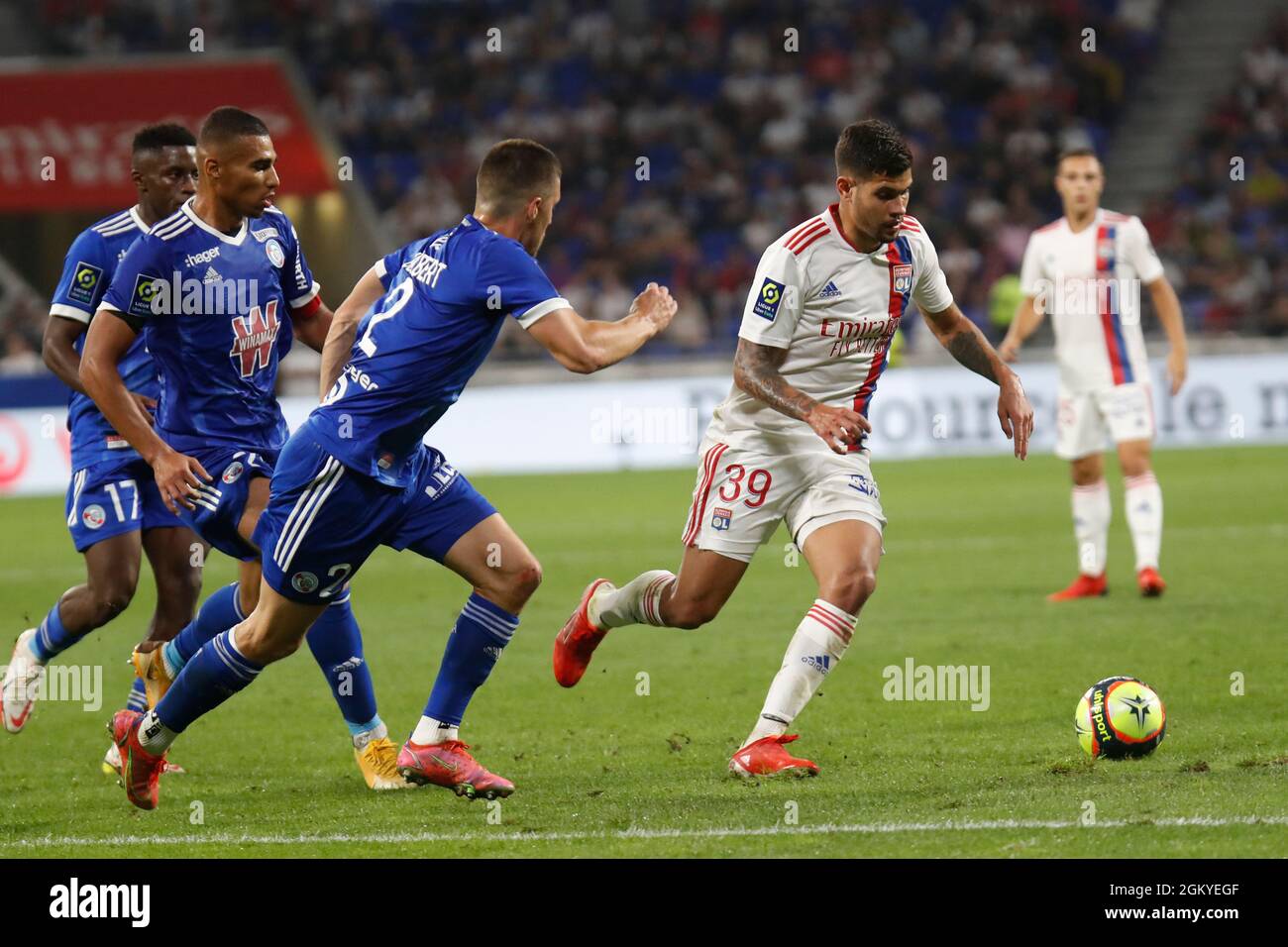 Bruno GUIMARAES of Lyon and Frederic GUILBERT of Strasbourg during the French championship Ligue 1 football match between Olympique lyonnais and Racing Club de Strasbourg Alsace on September 12, 2021 at Groupama Stadium in Décines-Charpieu, near Lyon, France - Photo Romain Biard / DPPI Stock Photo