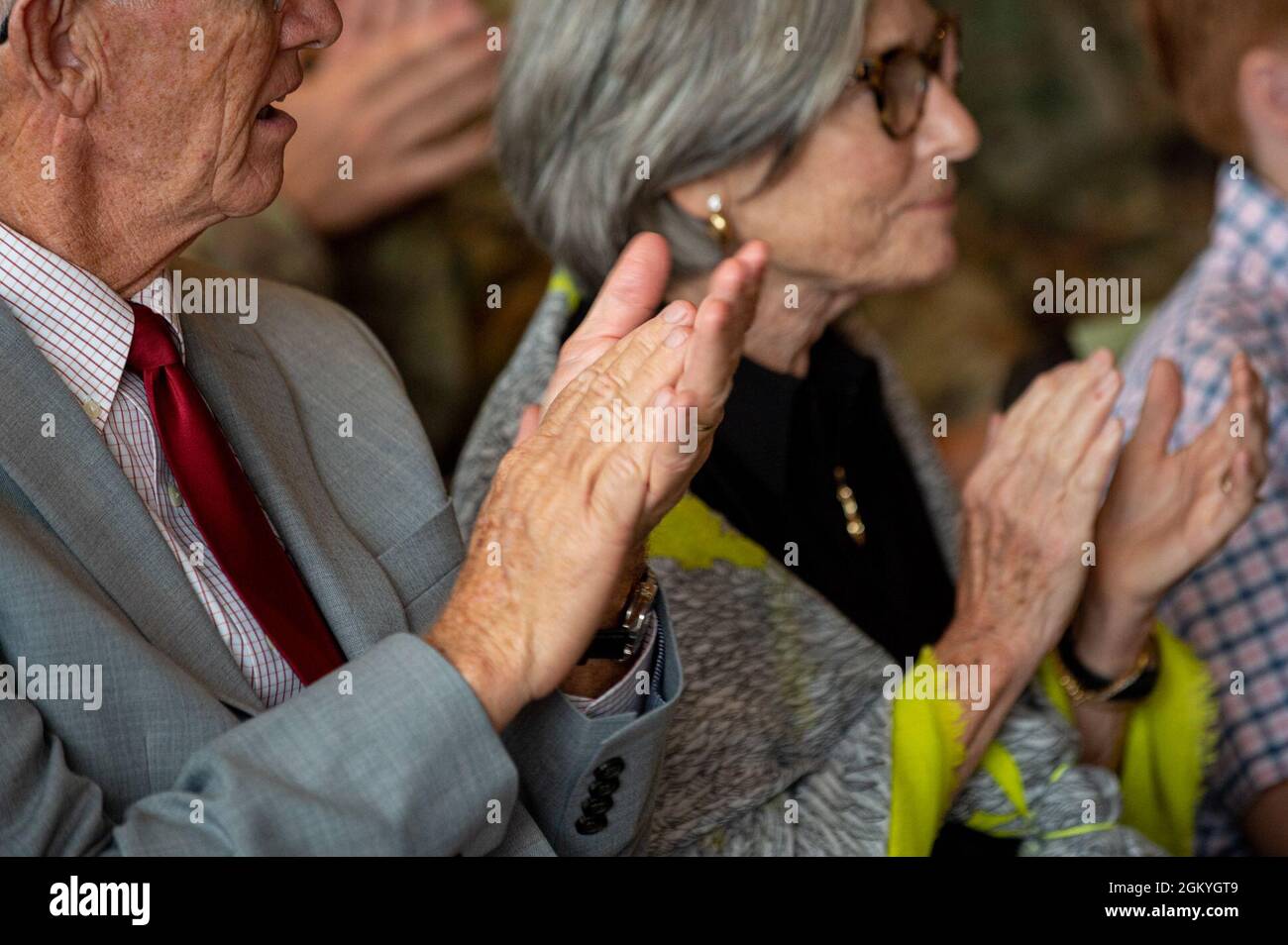 Audience and family applaud during the Pittsburgh District change of command ceremony at the Senator John Heinz History Center, in Pittsburgh, July 29, 2021. The change of command ceremony symbolizes the continuation of leadership and unit identity. It represents the transfer of responsibility and authority from one individual to another while continuing the mission. Stock Photo