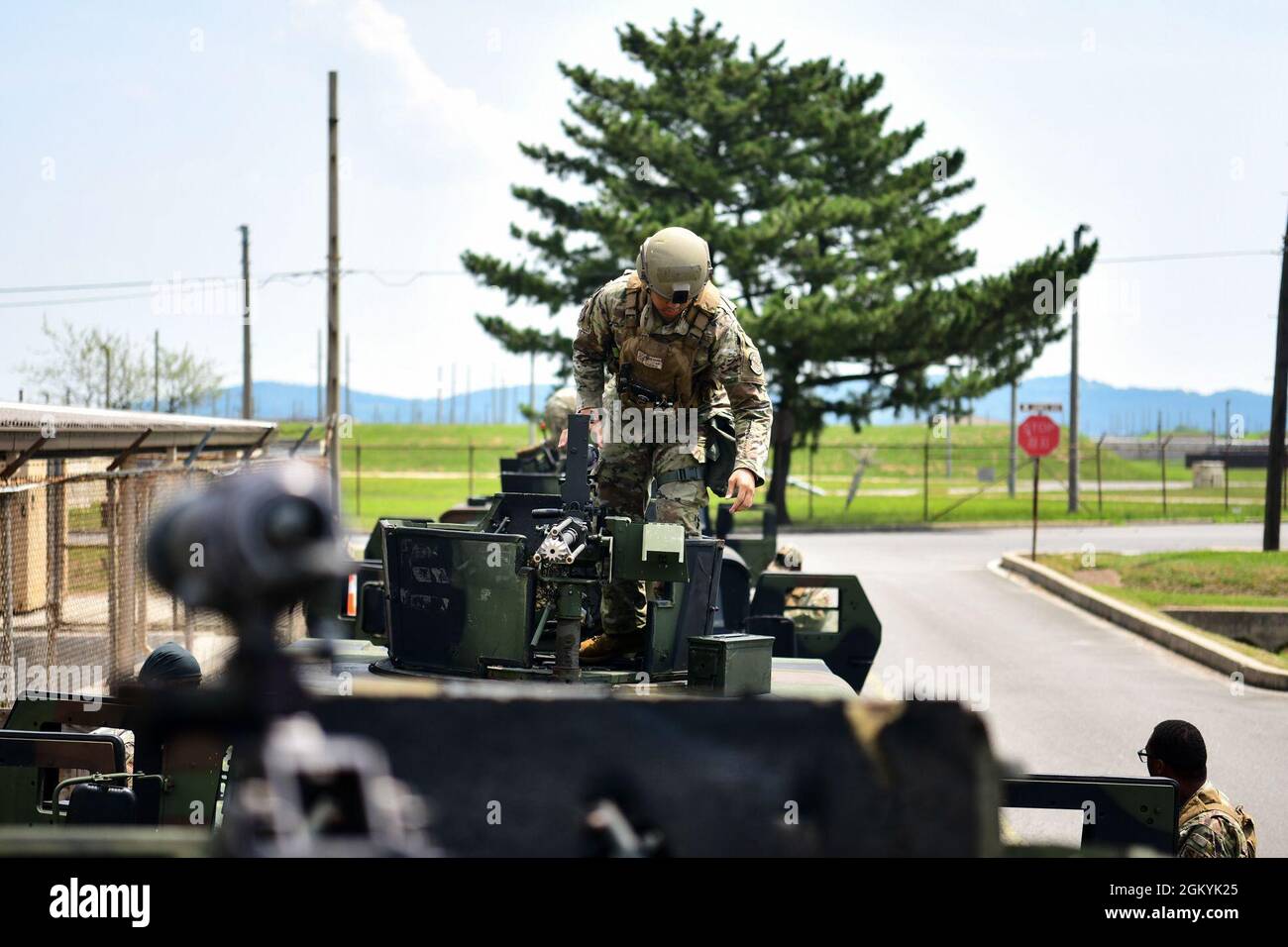 Airman 1st Class Steven Nguyen, 8th Security Forces Squadron defender, places bullets in an M-2 .50 caliber machine gun during a shift change at Kunsan Air Base, Republic of Korea, July 29, 2021. The priority mission for the Wolf Pack defenders is to secure installation assets, to include personnel and 5th-generation fighter aircraft. Stock Photo