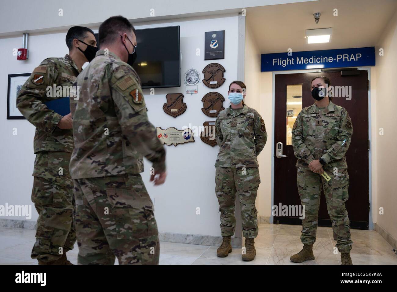 The 39th Air Base Wing command team (left) speaks with Staff Sgt. Marisa Cota (center), base operations medical clinic noncommissioned officer in charge, and 1st Lt. Logan Head, warrior medicine clinical nurse, both assigned to the 39th Operational Medical Readiness Squadron, during an immersion tour at Incirlik Air Base, Turkey, July 29, 2021. The command team’s visit was part of a series of immersion tours to offer firsthand experience about how each unit supports the missions and priorities of the 39th ABW and U.S. Air Forces in Europe-Air Forces Africa. The 39th Medical Group provides prev Stock Photo