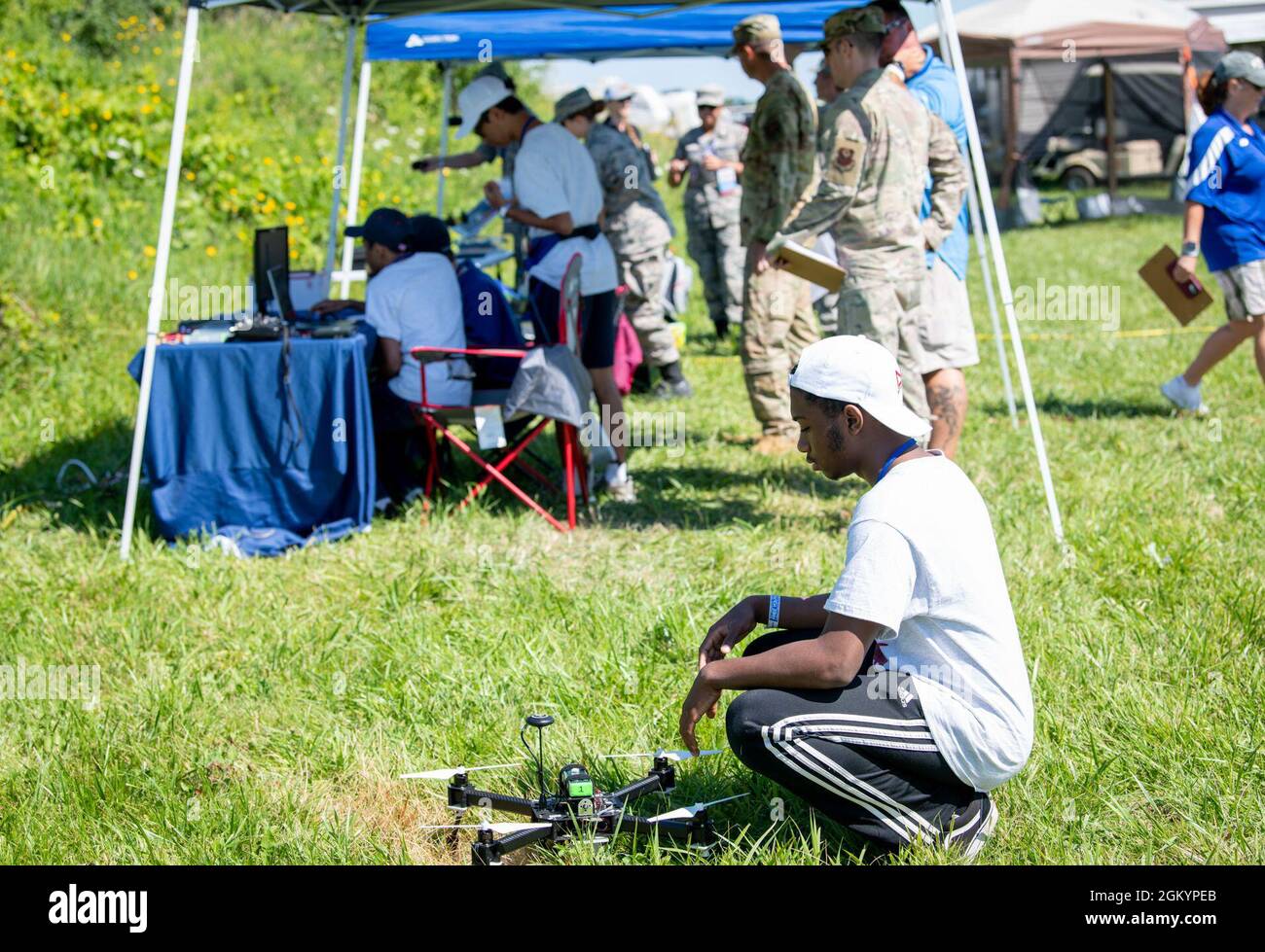 High school students prepare their Unmanned Aircraft System for take-off during a UAS competition for Science, Technology, Engineering and Mathematics at Wittman Regional Airport, Wis., July 30, 2021. STEM is a curriculum driven by problem-solving, discovery and exploratory learning, enabling students to find solutions to different situations through hands-on learning. Stock Photo