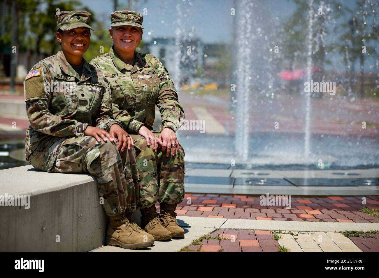 Maj. Eloisa Cox, brigade logistics officer, 3rd Armored Brigade Combat Team, 1st Armored Division shares a moment with her daughter, Spc. Ayana Anthony, a combat medic assigned to Charlie Company, 123rd Brigade Support Battalion, 3rd ABCT her while forward deployed to the Republic of Korea. Stock Photo