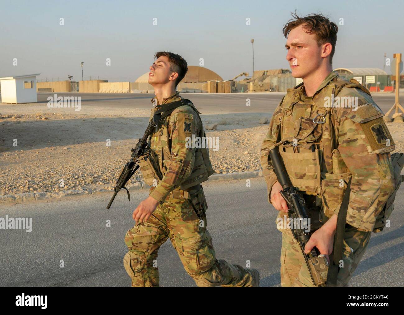 U.S. Army Spc. Taylor Hudson and Spc. Trenton Malmay conducts The Spur Ride at Al Asad Air Base