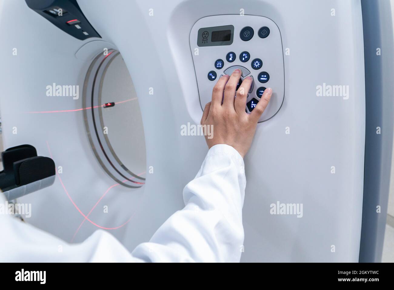 Doctor's hand manipulating the buttons of a high end Computerized ...