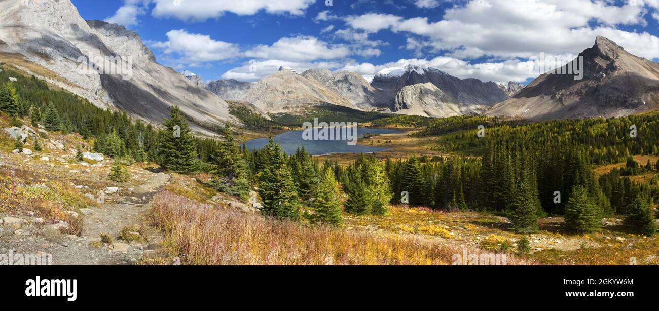 Scenic Panoramic Landscape View Beautiful Baker Lake Fall Hike in Skoki Area Banff National Park with Rugged Canadian Rocky Mountain Peaks on Skyline Stock Photo